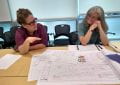 Tamara Gayer and architect Kathy Poissant meet to review site plans.