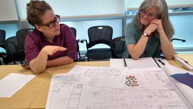 Tamara Gayer and architect Kathy Poissant meet to review site plans.