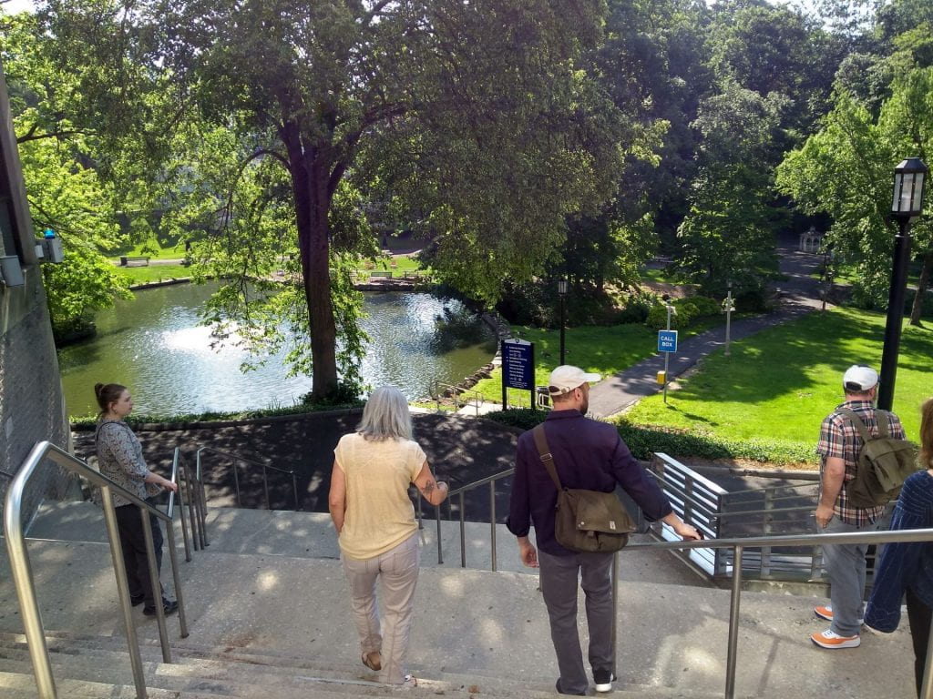 Committee members Yvonne Love and John Thompson lead us down towards the central duck pond on campus.